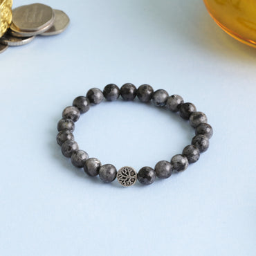 Larvakite Crystal Bracelet reveals hidden truths, protects and shields the aura, supports spiritual growth, enhances intuition, transforms negative energy, and awakens the inner alchemist.