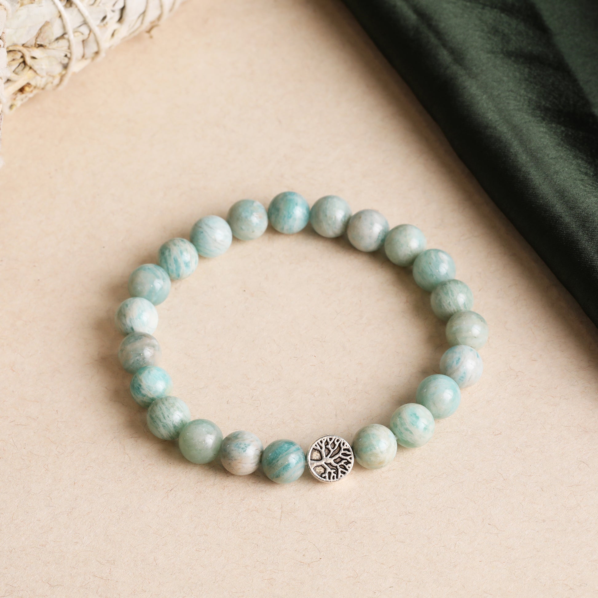 Amazonite Crystal Bracelet balances the emotional body and calms the storm within, promoting harmony, aura protection, clarity, open communication, inner peace, and energetic alignment with Star Codes.

